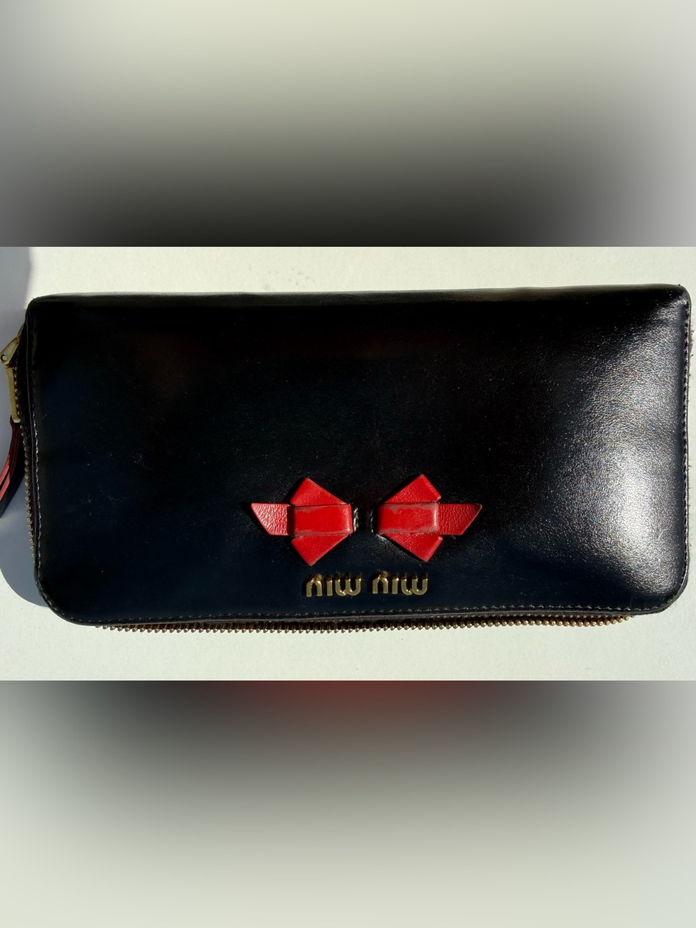 Miu Miu Black Leather Zip Wallet with Red Bow Accents